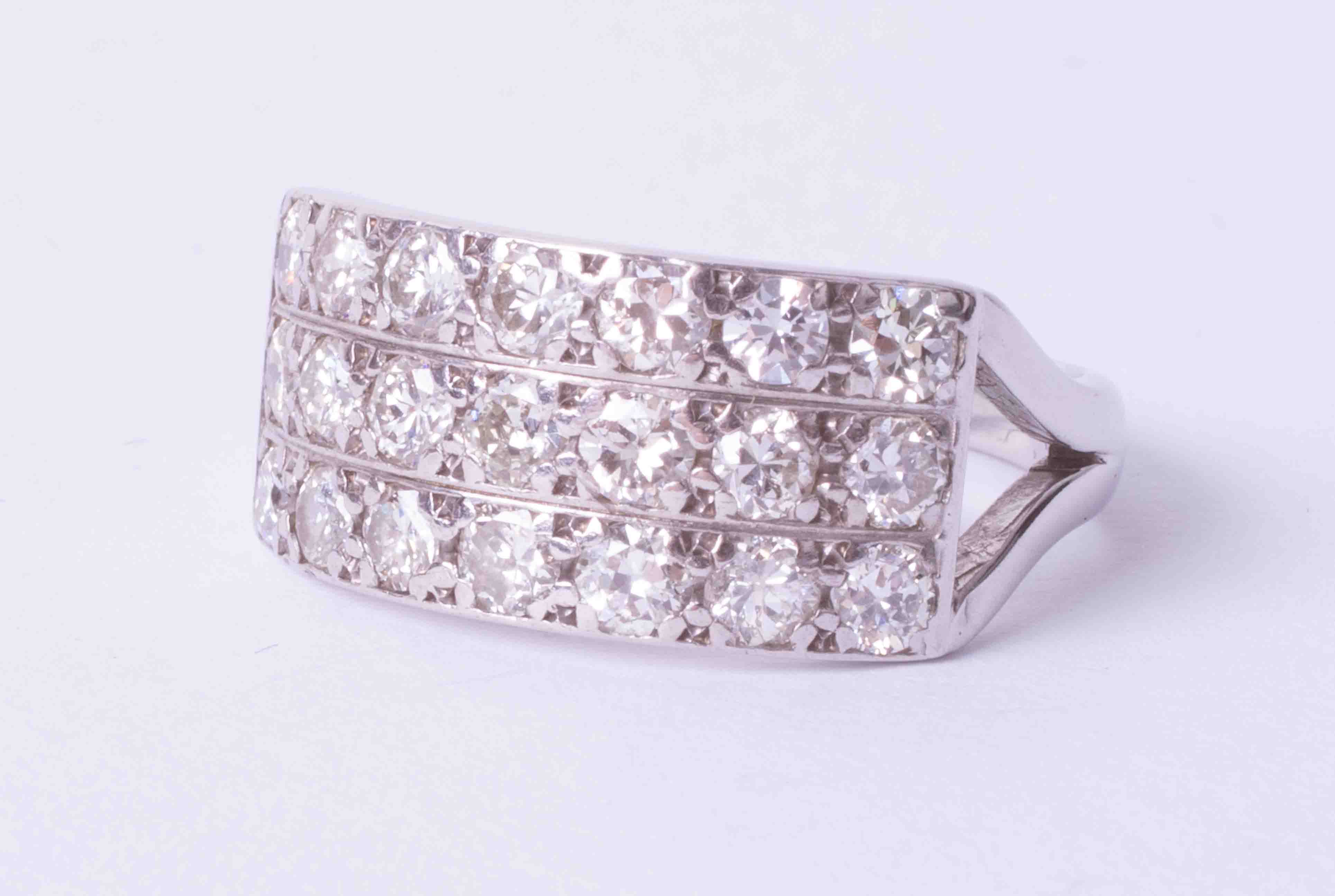 A diamond three row ring, approx. one carat diamond weight, size Q.