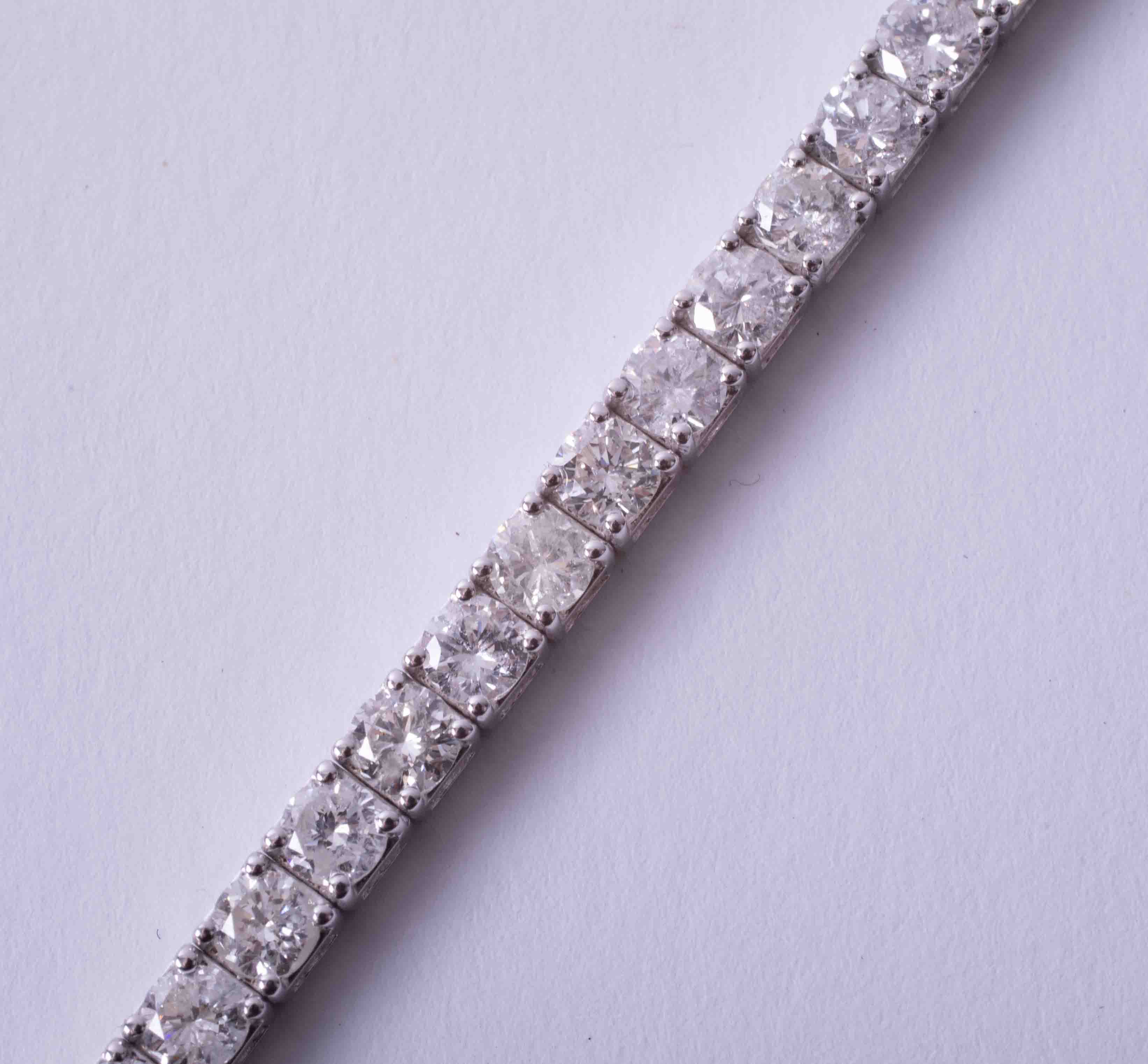 A fine 18ct white gold diamond line bracelet, total diamond weight approximately 8.20ct, set with - Image 5 of 9