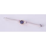 A sapphire and diamond bar brooch, 3.6gms.