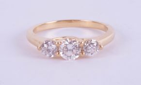 An 18ct yellow gold trilogy ring approx. 0.80ct, estimated colour E, clarity SI1, ring size M.