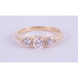 An 18ct yellow gold trilogy ring approx. 0.80ct, estimated colour E, clarity SI1, ring size M.