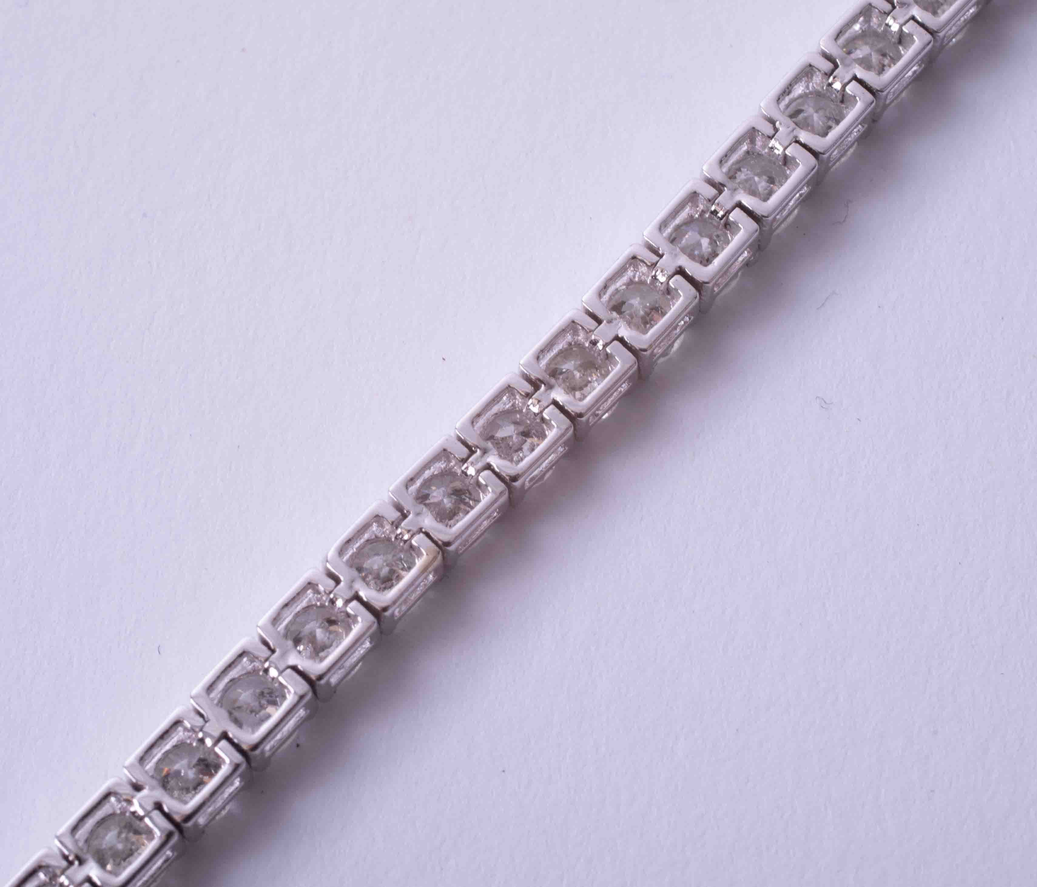A fine 18ct white gold diamond line bracelet, total diamond weight approximately 8.20ct, set with - Image 9 of 9