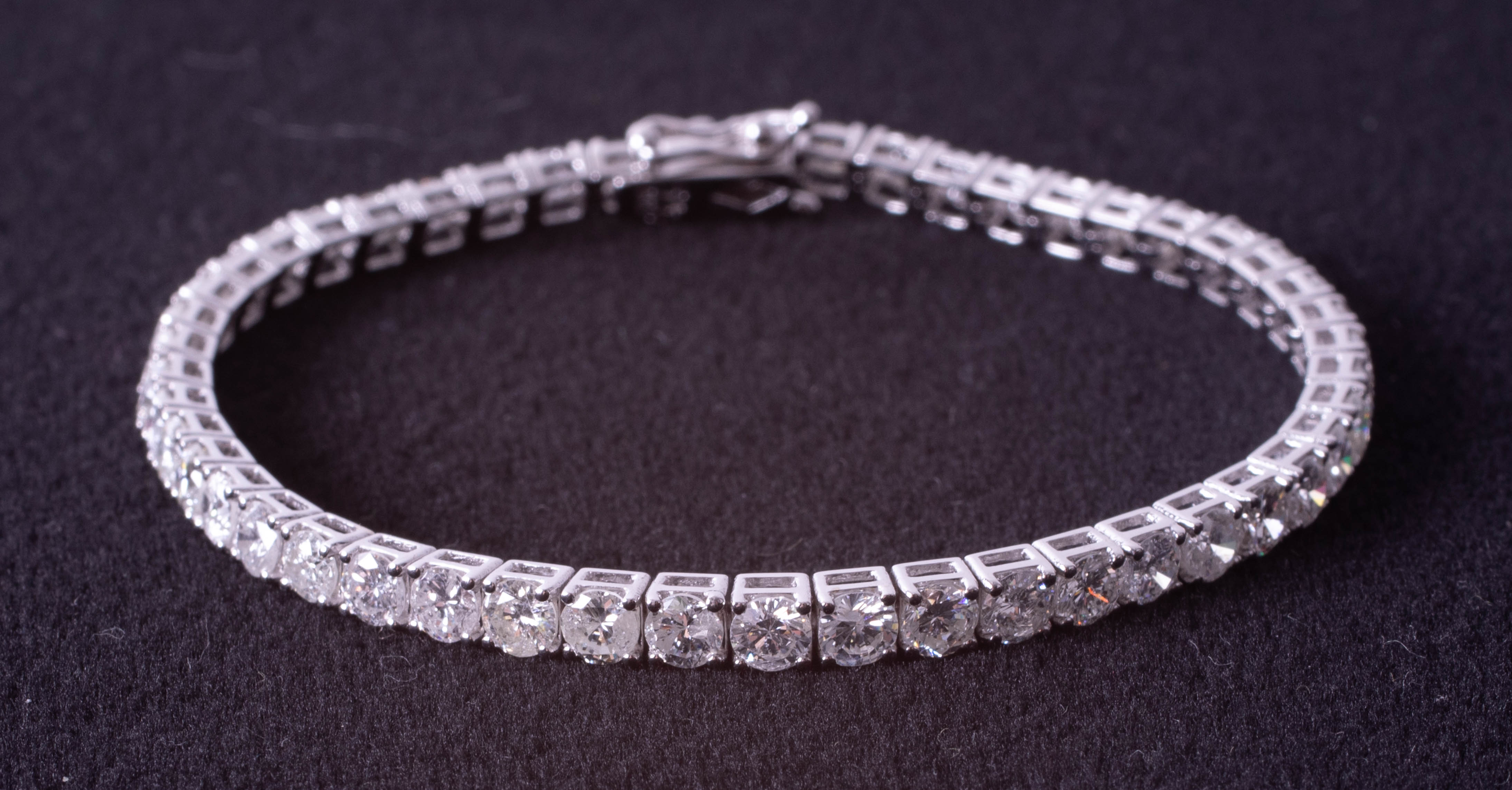 A fine 18ct white gold diamond line bracelet, total diamond weight approximately 8.20ct, set with - Image 3 of 9