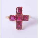 An antique ruby 'cruciform' five stone ring of good colour, circa 1900, size I.