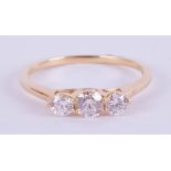 An 18ct yellow gold trilogy ring approx. 0.50ct, estimated colour and clarity E/SI1, ring size M.