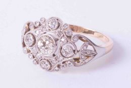 An early 20th century diamond ring, set with an arrangement of round cut diamonds, size R.