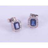 A pair 18ct white gold, diamond and sapphire cluster earrings.