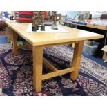 A good quality light oak refectory dining table, purchased from Codrington Furniture, London SW8,