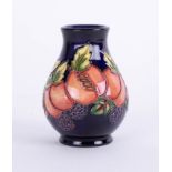 Moorcroft, small vase, Peaches pattenr, on blue ground, 10cm height.