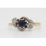 An 18ct sapphire and diamond set three stone ring, size O