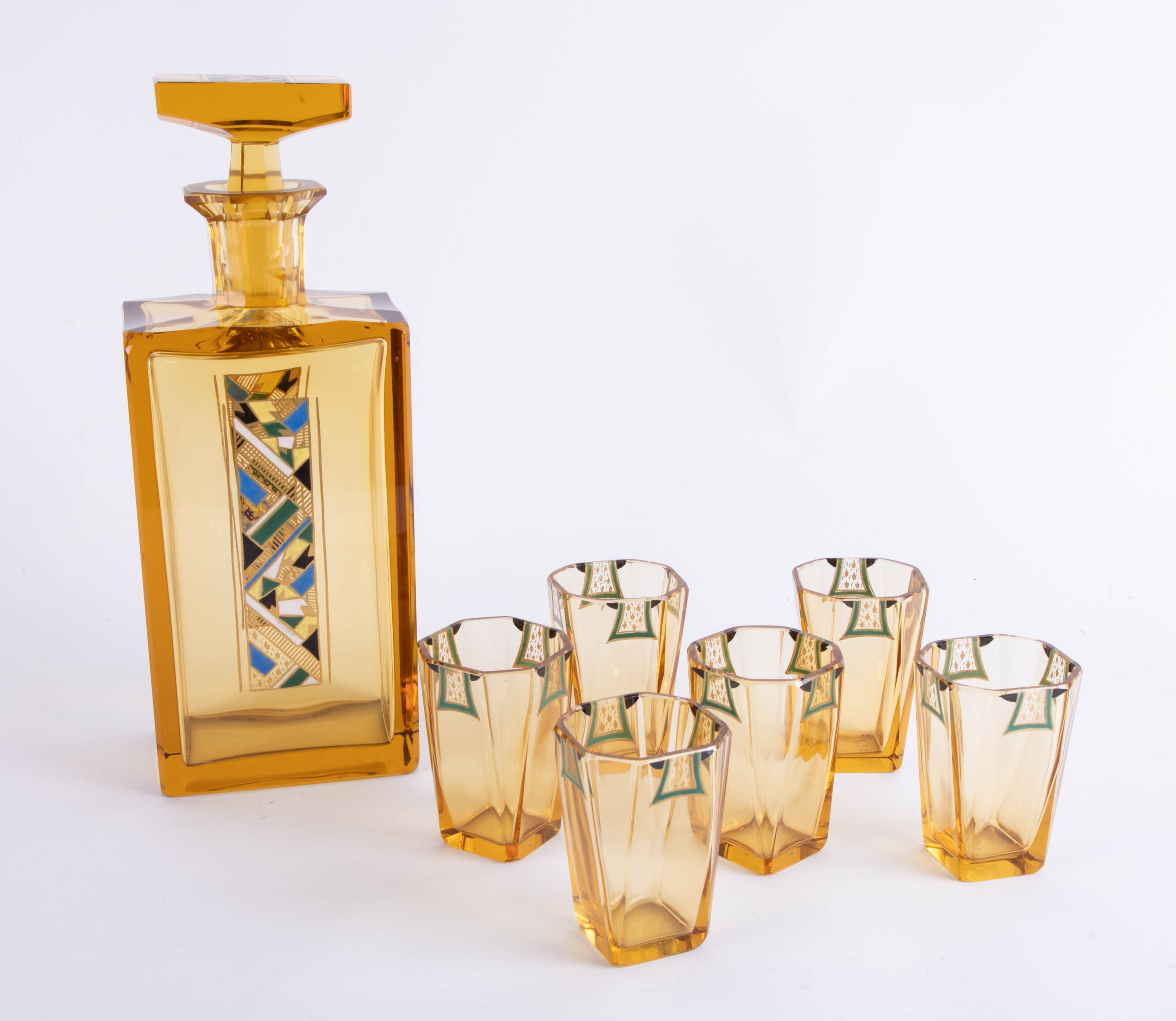 An Art Deco design amber glass seven piece drinks set comprising decanter, and six drinking