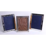 Three silver frames 7in x 5in, one plain and one ribbon and bow design, maker G.K. and C.K. and