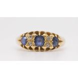 An 18ct sapphire and diamond set antique seven stone ring, size P.