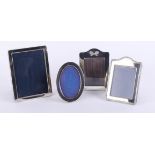 Four small silver frames, two by G.K. and C.K with two others, three 3.5in x 2.5in and one 3.5in x