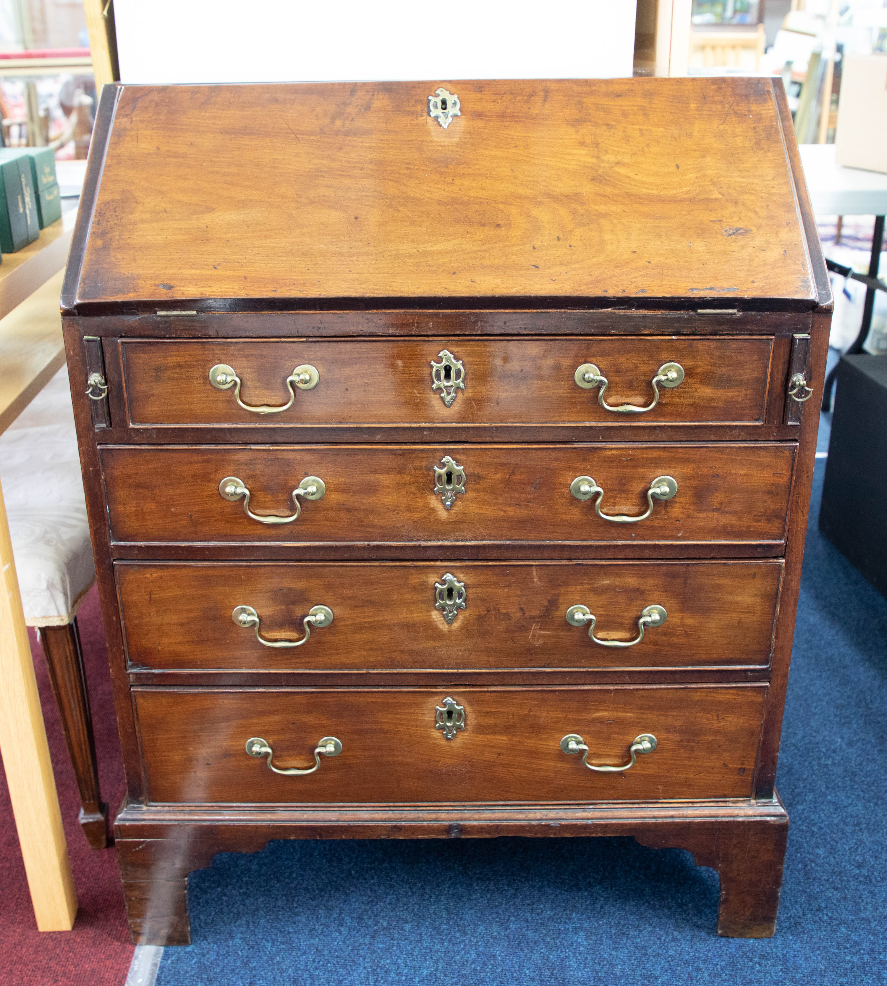 An 18th century mahogany bureau, the fall with a fitted interior over four graduated long drawers