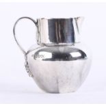 A silver early Victorian cream jug with plain bulbous body and ribbed fancy foliate handle, Young