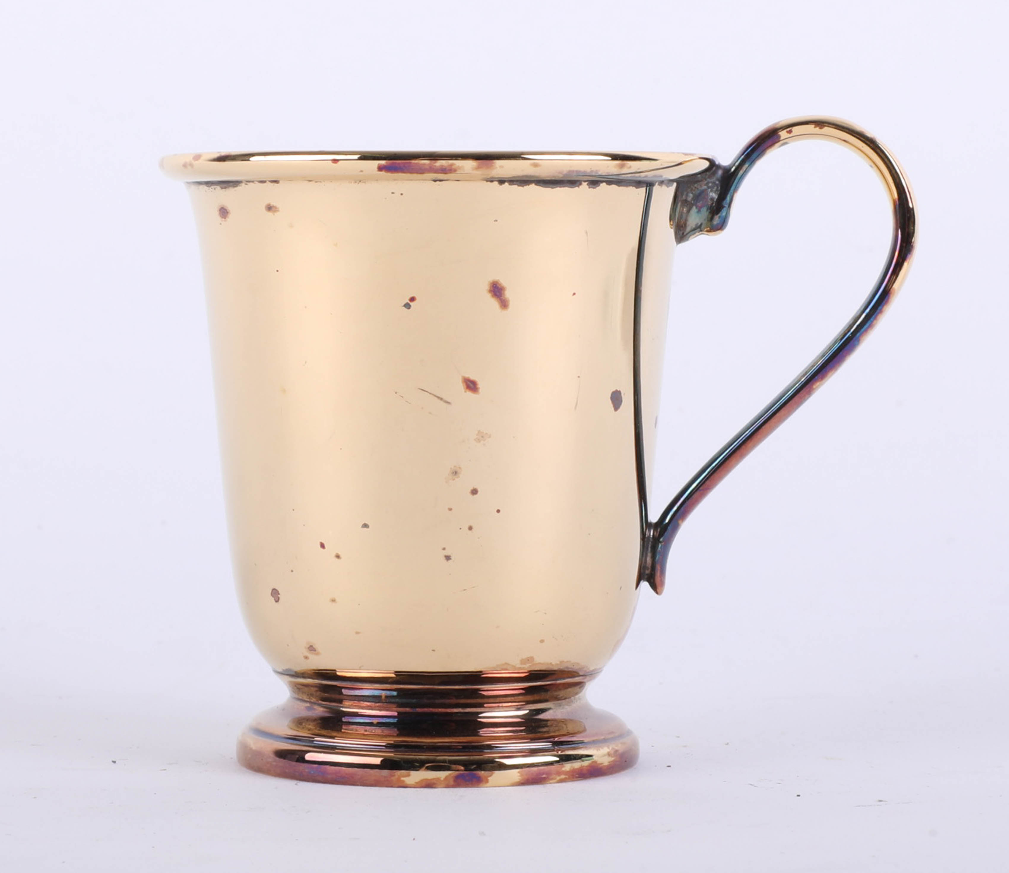 A silver gilt christening beaker with looped handle, stamped .925, Sheffield maker R.C., height 7.