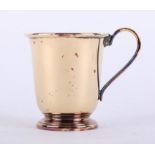 A silver gilt christening beaker with looped handle, stamped .925, Sheffield maker R.C., height 7.
