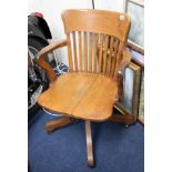 An oak office swivel chair, early 20th century.