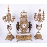 A large continental gilt and marble style three piece clock garniture set decorated with cherubs,