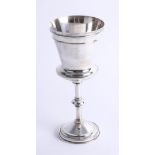 A silver challis with ribbed graduated bowl, rising stem with mid decoration and matching round