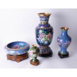 Three 20th Century Cloisonné vases and a bowl all on carved wood stands, tallest vase 39cm.