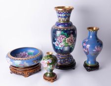 Three 20th Century Cloisonné vases and a bowl all on carved wood stands, tallest vase 39cm.