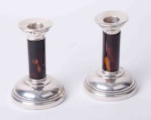 A pair of silver and tortoise shell candlesticks, faults, height 13cm.