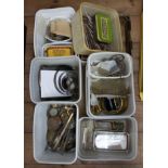 A quantity of various watchmakers parts, brass turnings, cogs, tools, springs, pendulums etc.