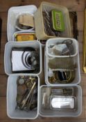 A quantity of various watchmakers parts, brass turnings, cogs, tools, springs, pendulums etc.