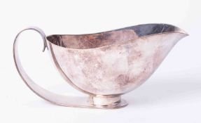 A Sheffield silver plated sauce boat of Arts & Crafts style.