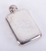 A silver hip flask with inscription dated 1917, height 14cm, approximately 4.80oz.