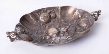 A silver embossed small fruit dish, width 17cm.