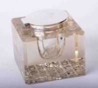 A large square silver and glass inkwell, width 9cm.