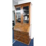 A late 19th early 20th century oak bureau bookcase, width 91cm.