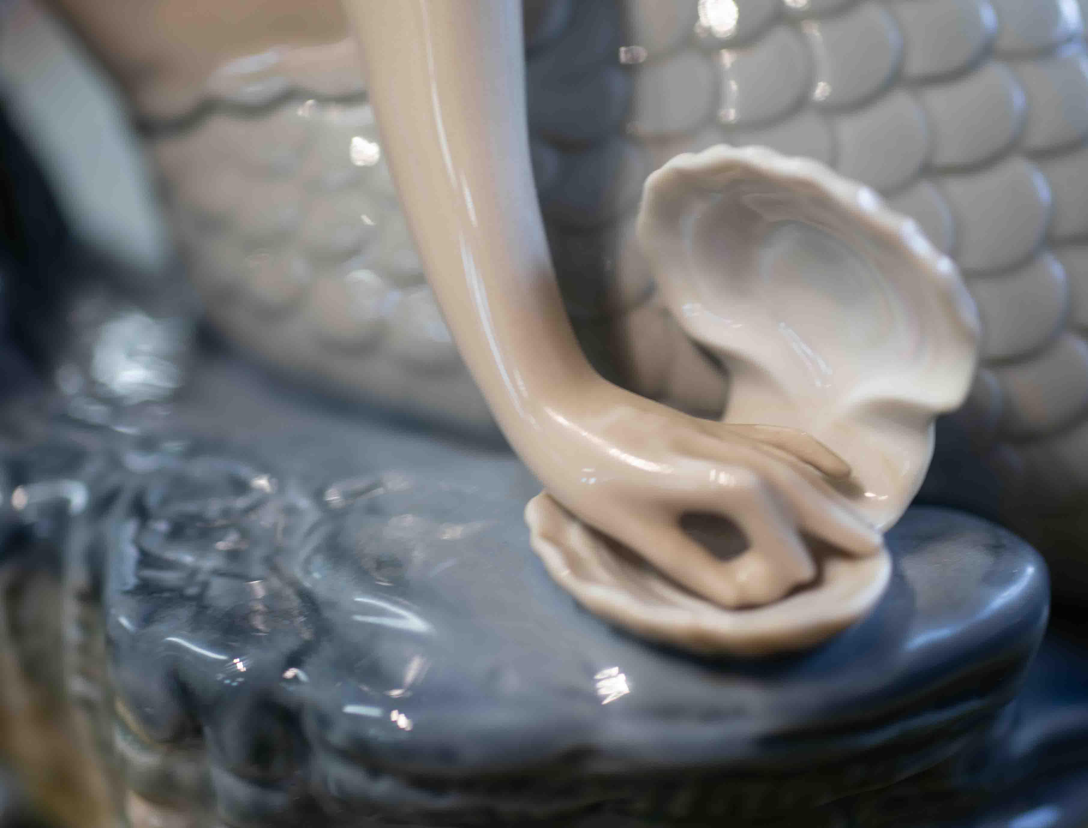 Lladro, a porcelain figure of a Mermaid on a rocky base, height 30cm. - Image 3 of 8