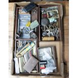 Various watchmakers tools including screw drivers, files, punch tools, squares chuck, small bits and