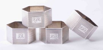 Matched set of 4 solid silver hexagonal shaped napkin rings with engine turned decoration hallmark