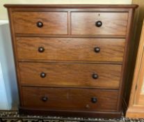 An early 20th Century mahogany straight front chest of drawers fitted with five drawers.