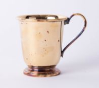 A silver gilt christening beaker with looped handle, stamped .925, Sheffield maker R.C., height 7.