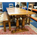 Brights of Nettlebed, a good quality oak 'trestle' table of antique style together with a long bench