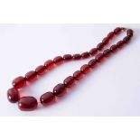 Antique single row ruby red amber necklace strung on wild silk with yellow gold bolt ring clasp,