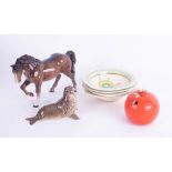 A Beswick horse, four Clarice Cliff cereal bowls, a Beswick seal and a marmalade pot.