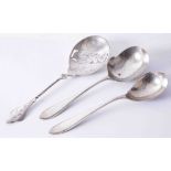 Three Dutch silver spoons (2 matching servers and 1 fancy pierced fruit server with twisted stem)