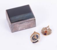 A white metal square pill box together with a Scottish thistle brooch and a meritorious service