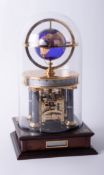 A Franklin Mint National Geographic Society Millenium clock, eight-day movement, glass dome, 32cm