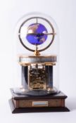 A Franklin Mint National Geographic Society Millenium clock, eight-day movement, glass dome, 32cm