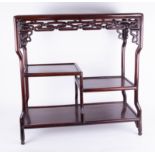 A Chinese rosewood stand with two tiers, height 74cm, width 72cm, depth 30cm.