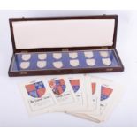 The Royal Arms silver collection of twelve heraldic shield crests in fitted case with card