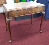 A walnut side table fitted with a single drawer on shaped legs, width 91cm together with a 19th